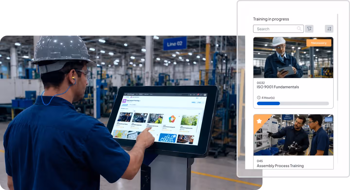 Factory operator using a touchscreen kiosk to access workplace training courses on the shop floor. The interface displays training modules, progress tracking, search functionality, and course categories for continuous employee learning.